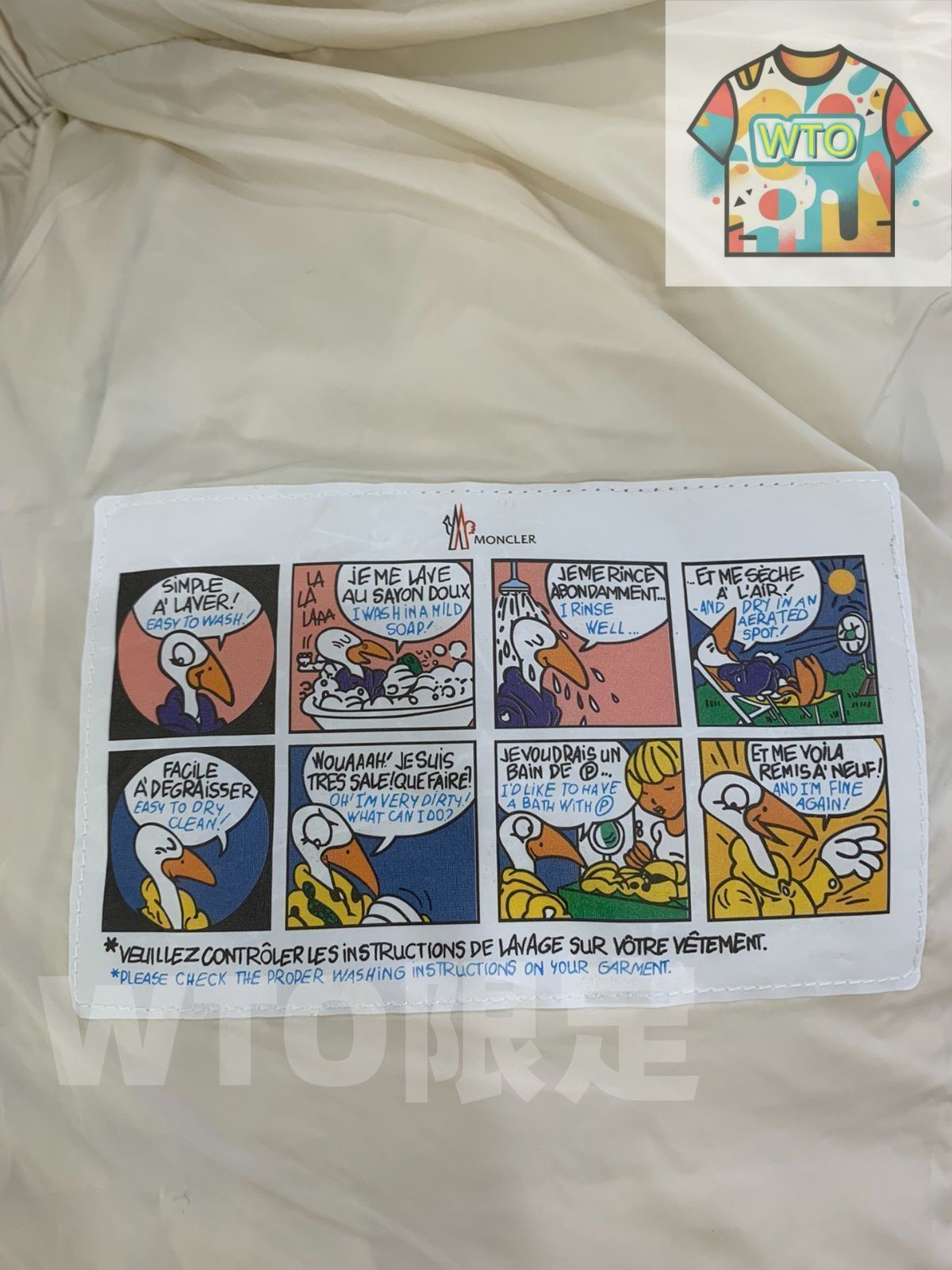 MONCLERモンクレール ベージュグレーのフード付きv縫い糸デザイン