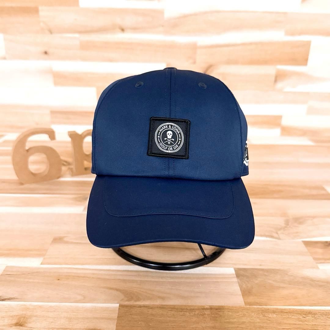 マークアンドロナ】ナイロン スクエア ワッペン スカルロゴ キャップ紺