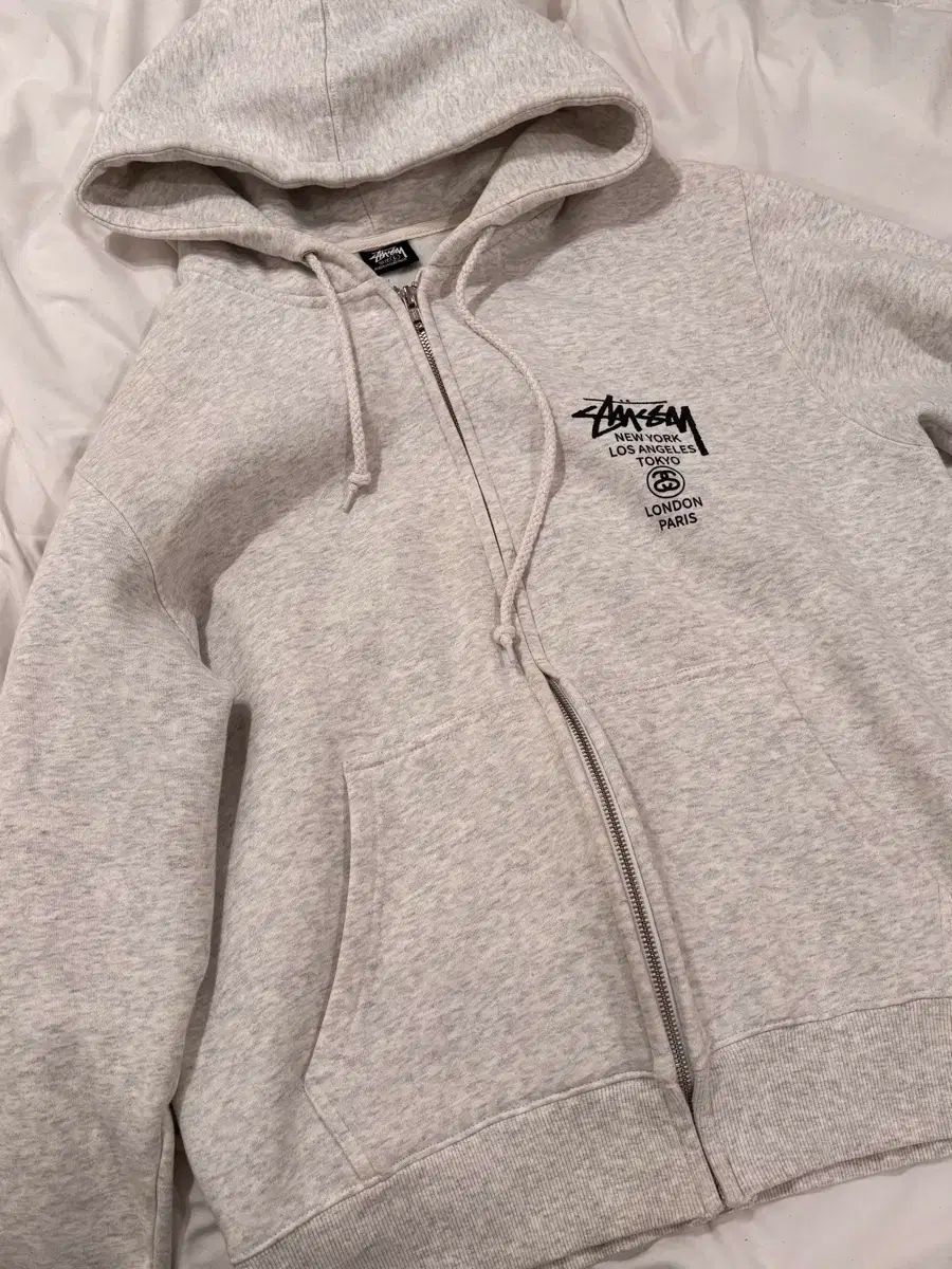 STUSSYワールドツアー ジップアップフーディー L アッシュヘザー
