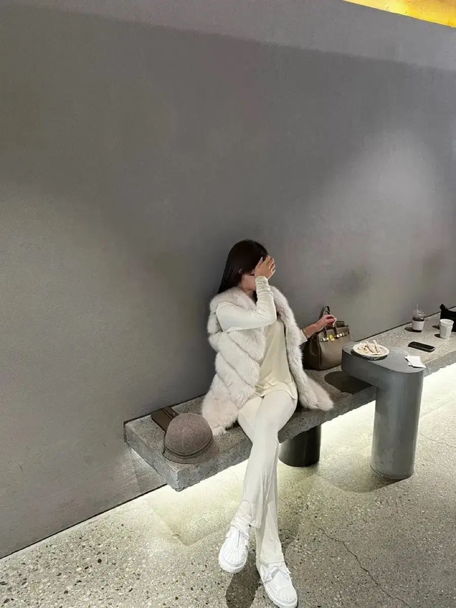 ポンポン段々フェイクファーベスト