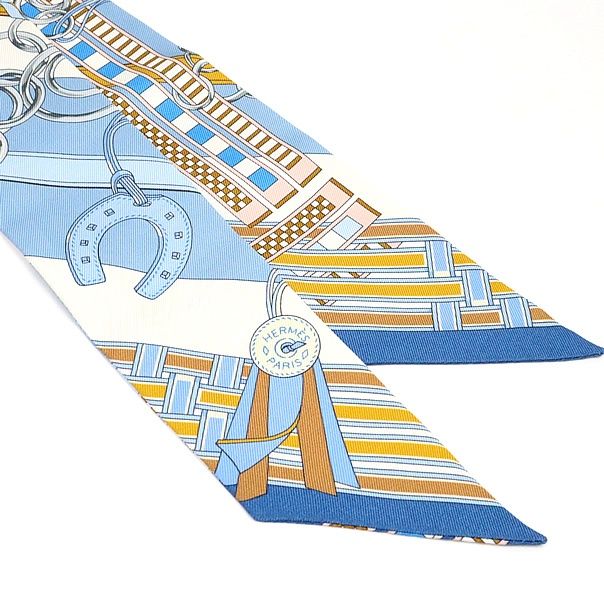 エルメス HERMES ツイリー Brides et Gris-Gris 馬勒とチャーム 水色系 マルチ シルク 17690