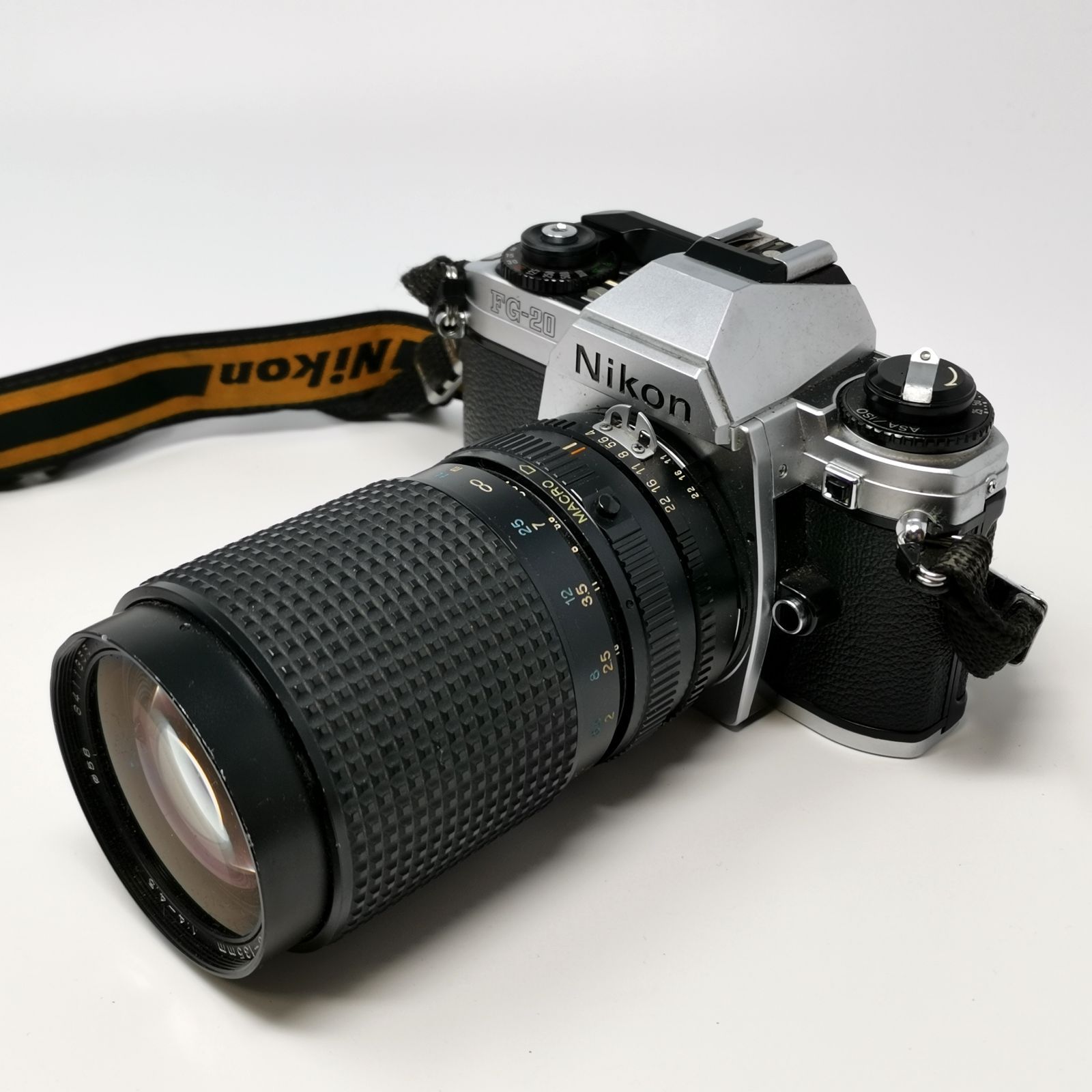 Nikon FG 20 フィルム一眼レフカメラ レンズ付き トニカ RMC Tokina 35 135 mm フィルムないため動作未 ソフトケースあり 管理番号