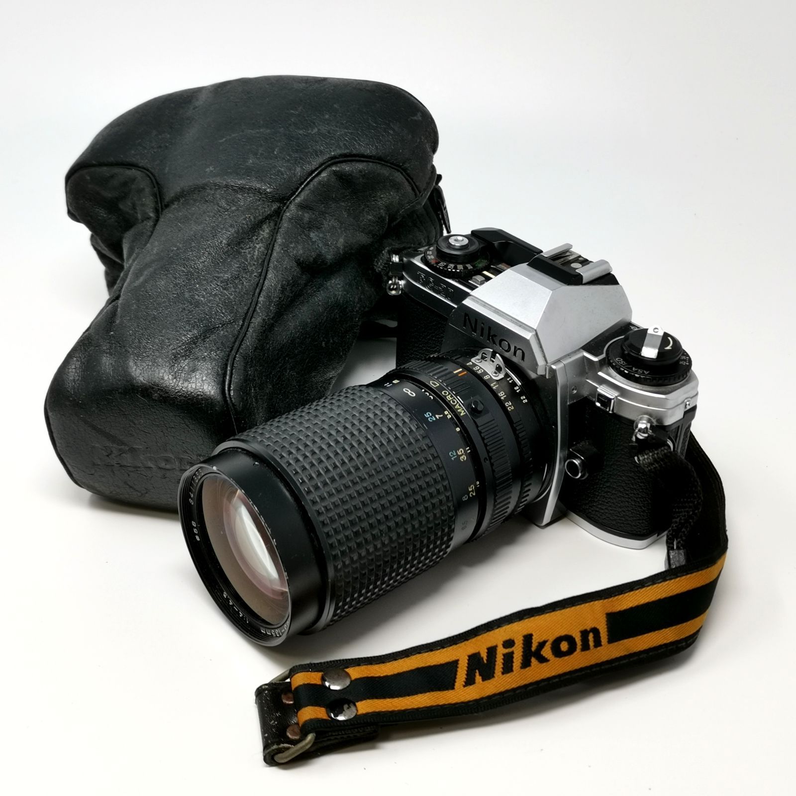 Nikon FG 20 フィルム一眼レフカメラ レンズ付き トニカ RMC Tokina 35 135 mm フィルムないため動作未 ソフトケースあり 管理番号