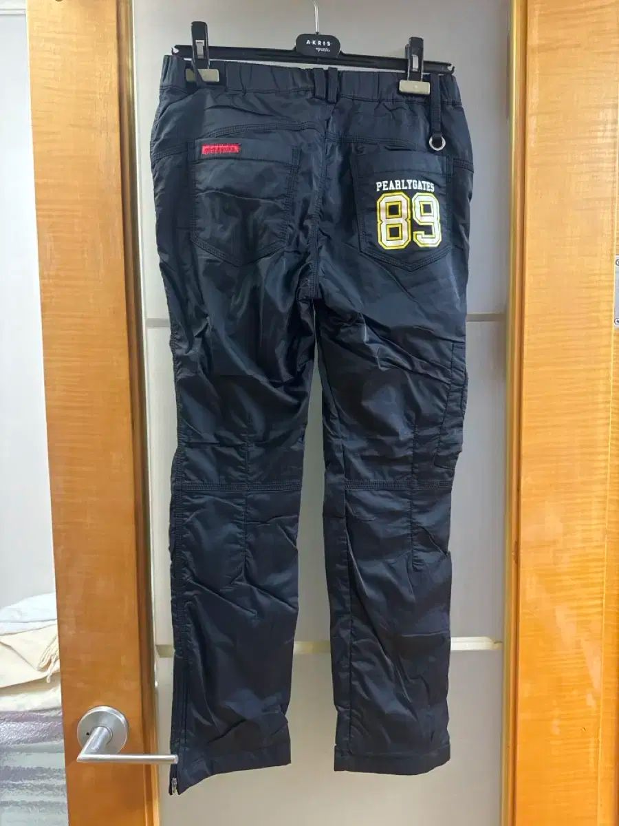 PEARLYGATES ブラック ズボン - メルカリ