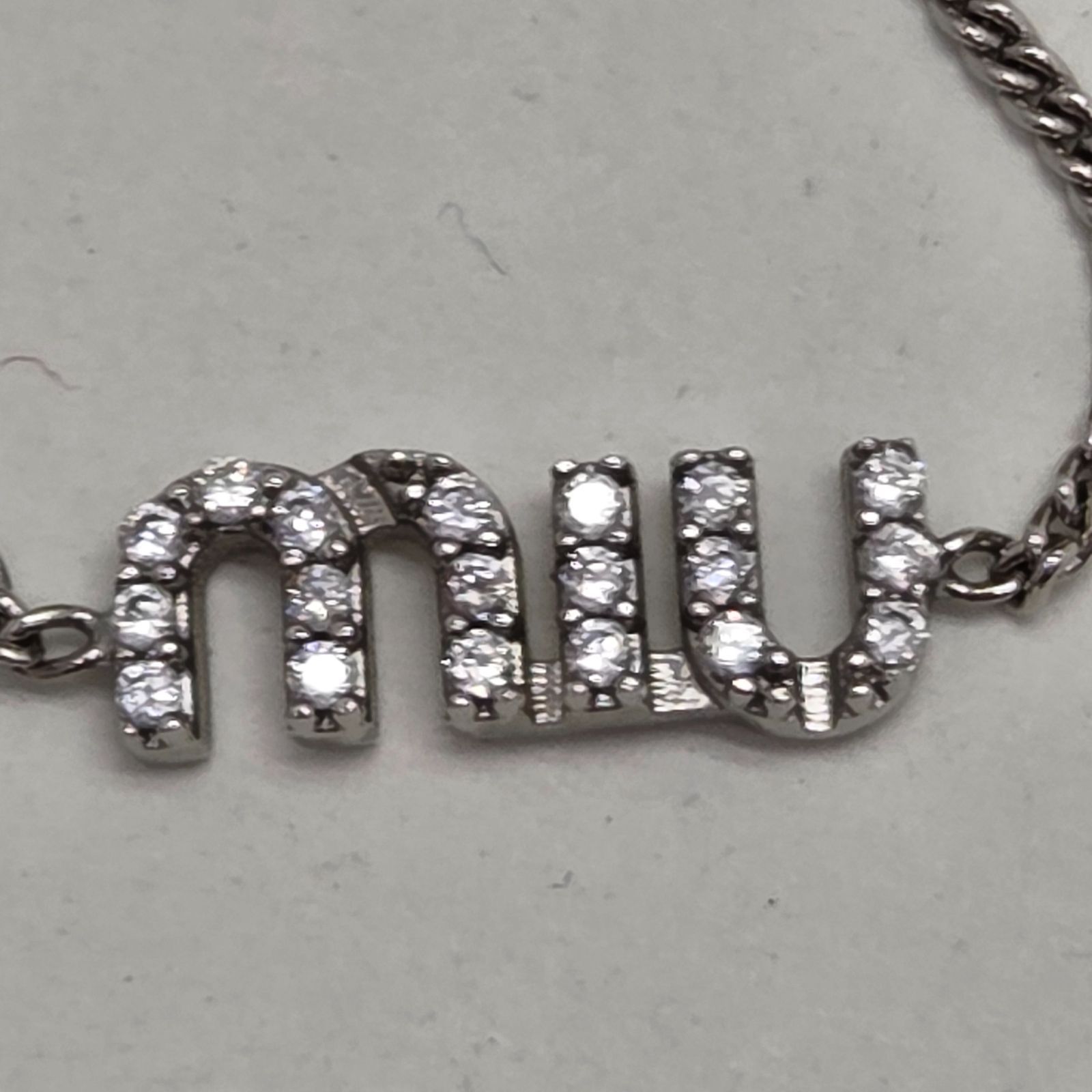11 S00270 MIUMIU ブレスレット ロゴ クリスタル - メルカリ