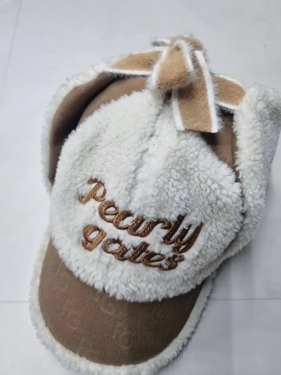 パーリーゲイツ 耳あて付き帽子 リボン