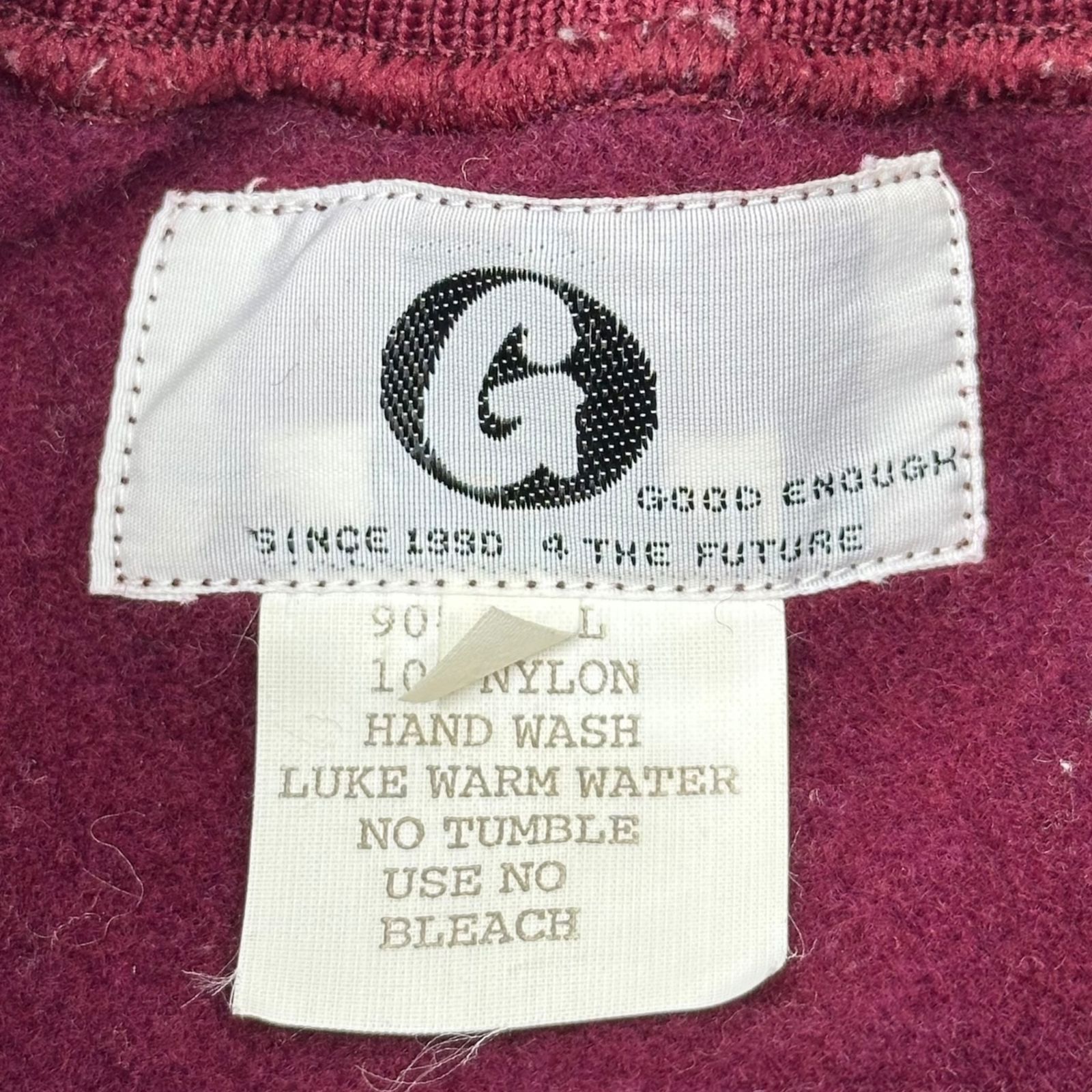 GOODENOUGH(グッドイナフ) 90's Logo Patch High-Neck Wool Sweatshirt