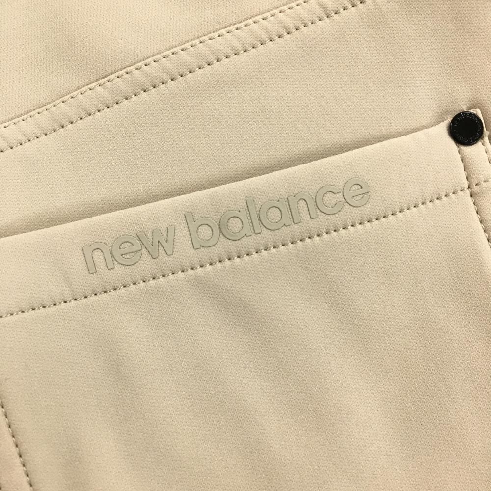 美品】ニューバランスゴルフ パンツ ベージュ ジップライン蛍光