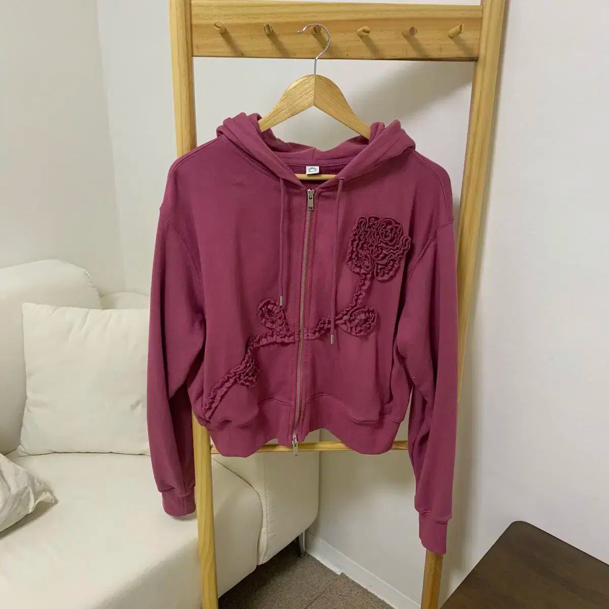 シヌーン ローズフリル フードジップアップ