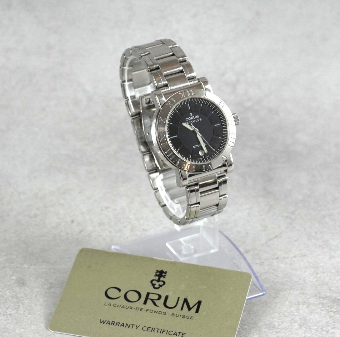 CORUM コルム ROMVLVS ロムルス 82 701 20 自動巻き オートマチック 腕時計 メンズ 黒文字盤 SS デイト 裏スケ 3針 スイス製 SWISS MADE 稼働品 ベゼル刻印 ローマ数字 アンティーク レトロ 機械式
