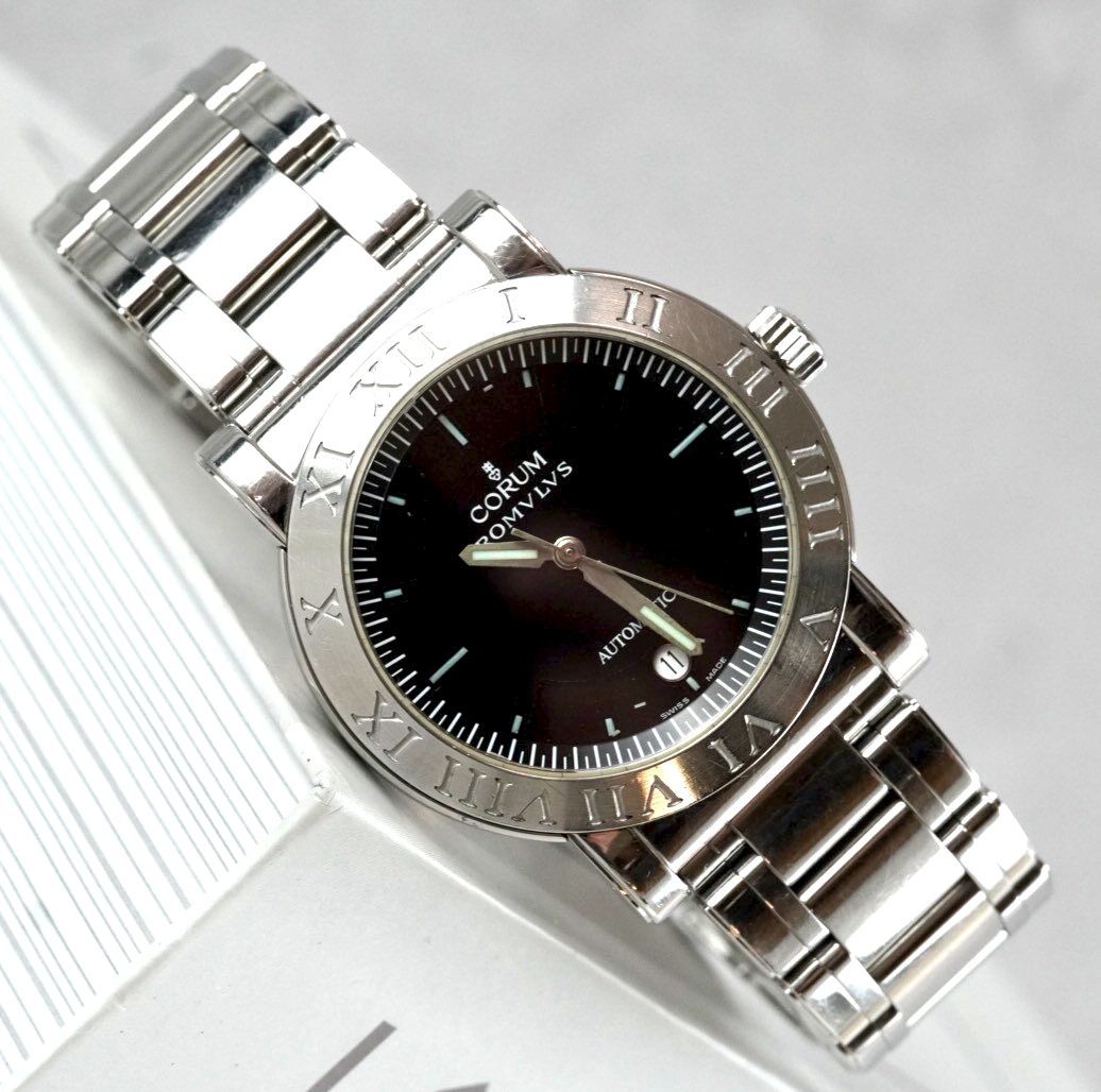 CORUM コルム ROMVLVS ロムルス 82 701 20 自動巻き オートマチック 腕時計 メンズ 黒文字盤 SS デイト 裏スケ 3針 スイス製 SWISS MADE 稼働品 ベゼル刻印 ローマ数字 アンティーク レトロ 機械式