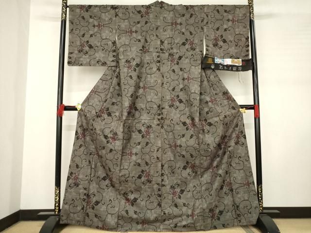 平和屋着物 本場大島紬 純泥染 手織り 一元7マルキ 花唐草文 岡江武美作 証紙付き 正絹 ck