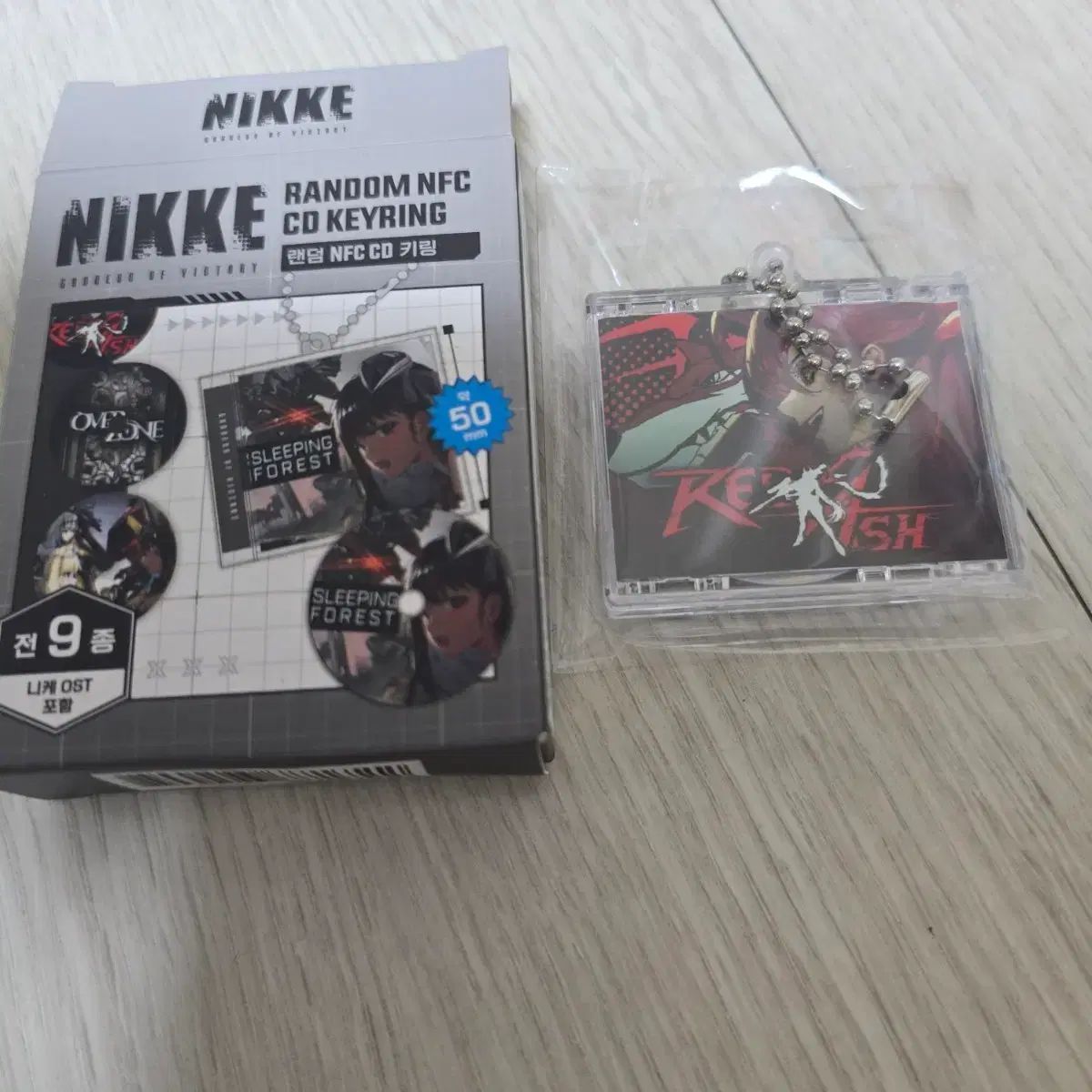 勝利の女神：NIKKE(ニケ) NFC CDキーホルダー レッド アッシュ - メルカリ