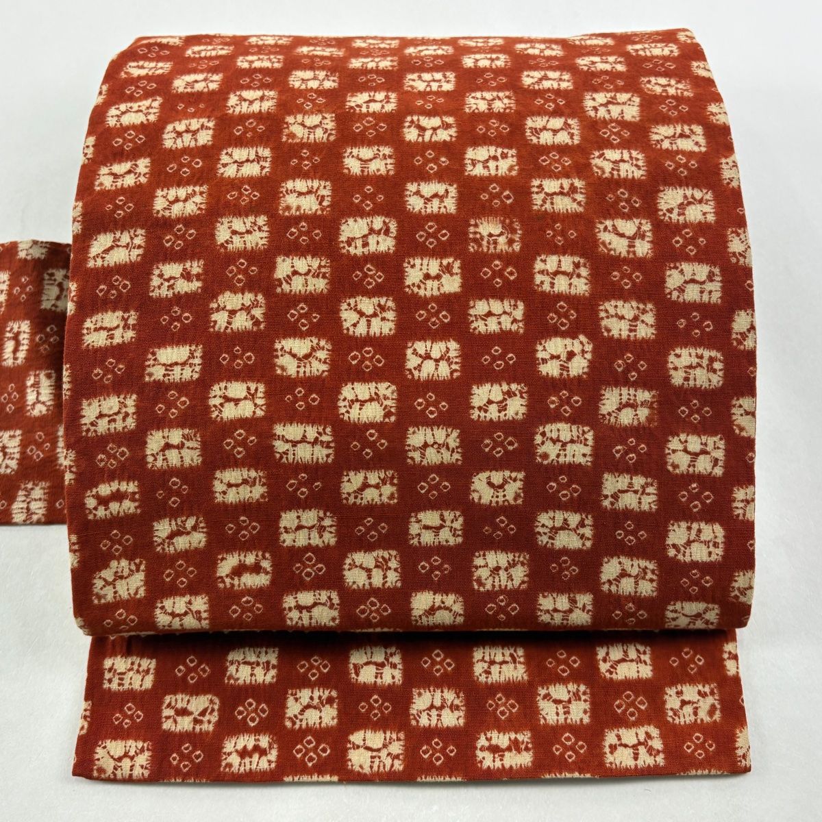 名古屋帯 紬地 動物 変わり市松 絞り 赤茶 正絹