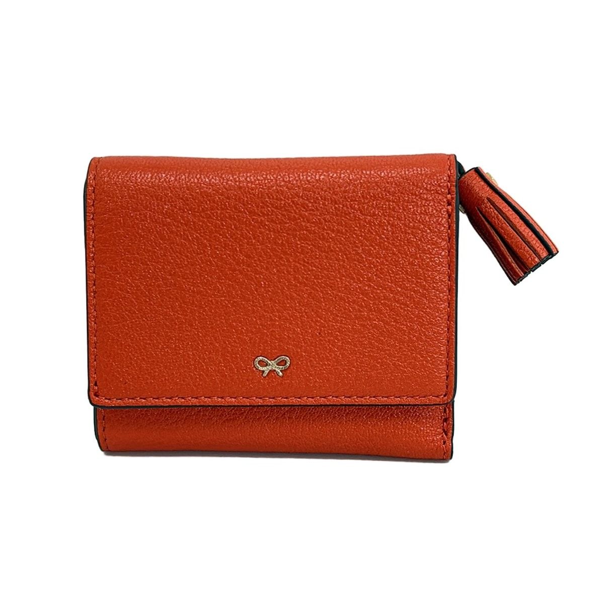 Anya Hindmarch アニヤハインドマーチ 3つ折り財布 ミニ トライフォード ピーピング アイズ オレンジ タッセル L字ファスナー レザー
