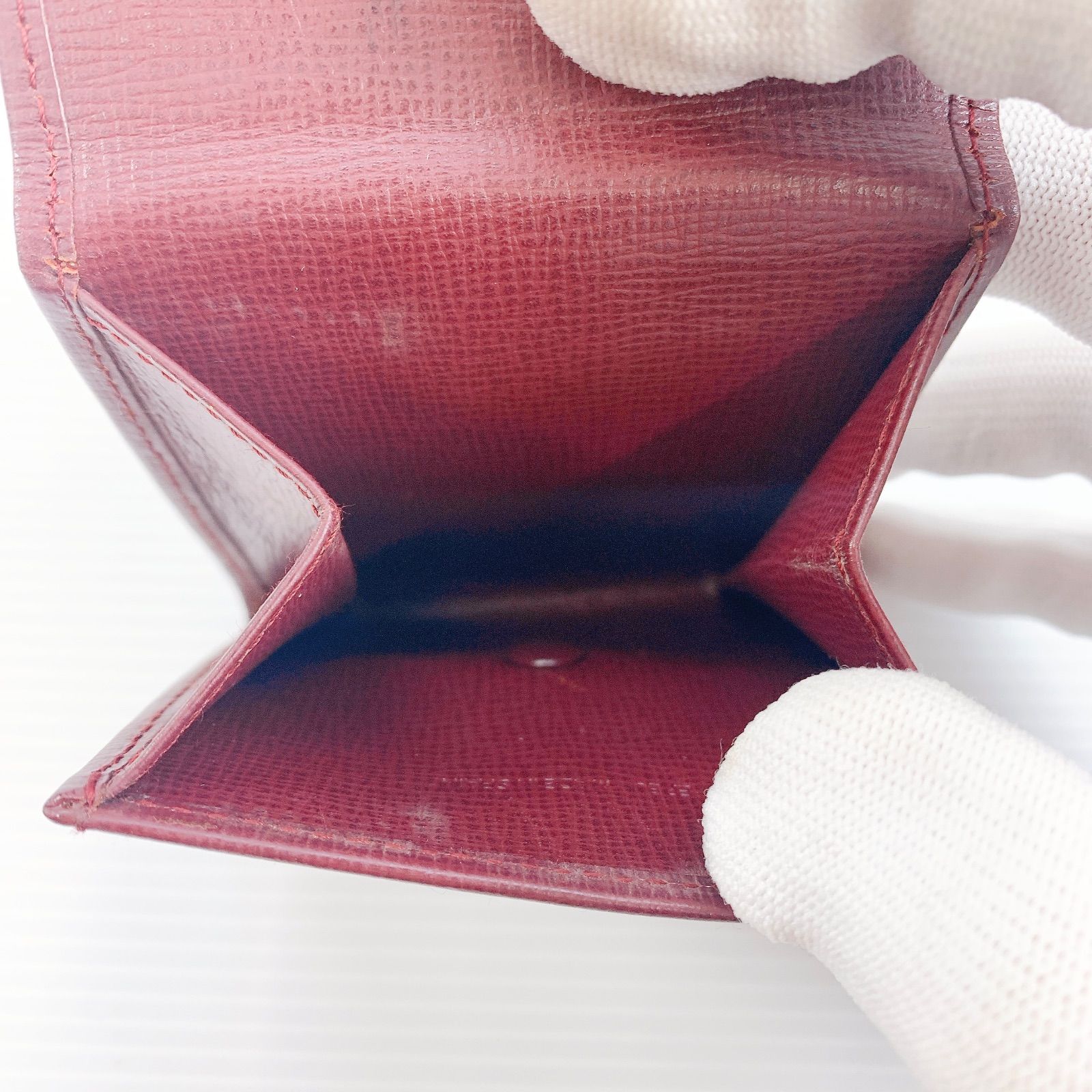 H-149 カルティエ Cartier 小銭入れ ボルドー系 レザー 丸型ロゴ