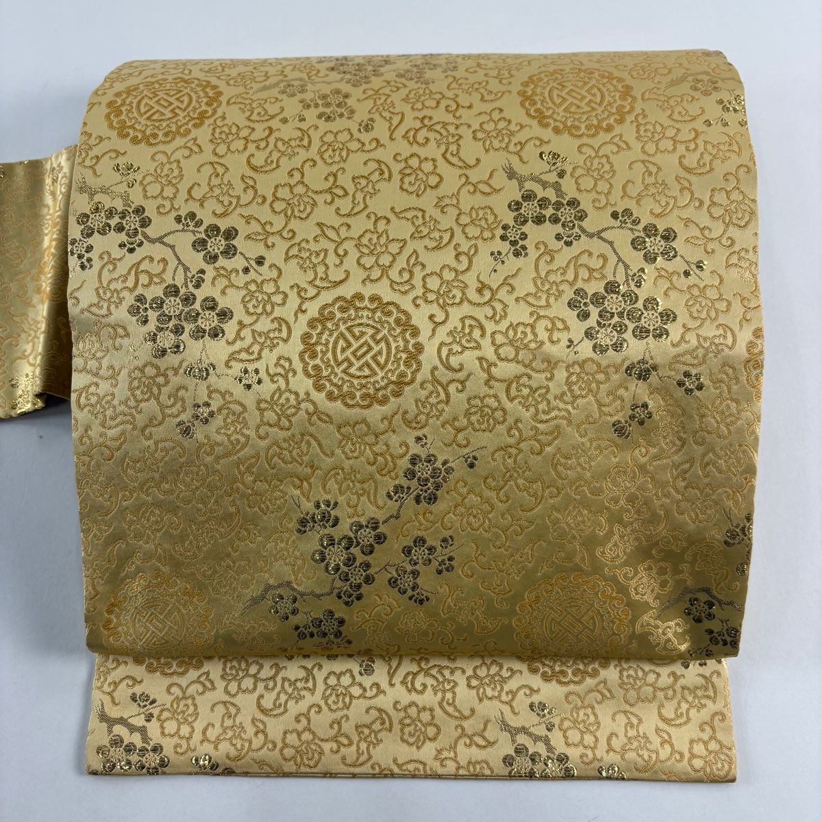 名古屋帯 秀品 枝梅 花唐草 箔 薄オレンジ 正絹
