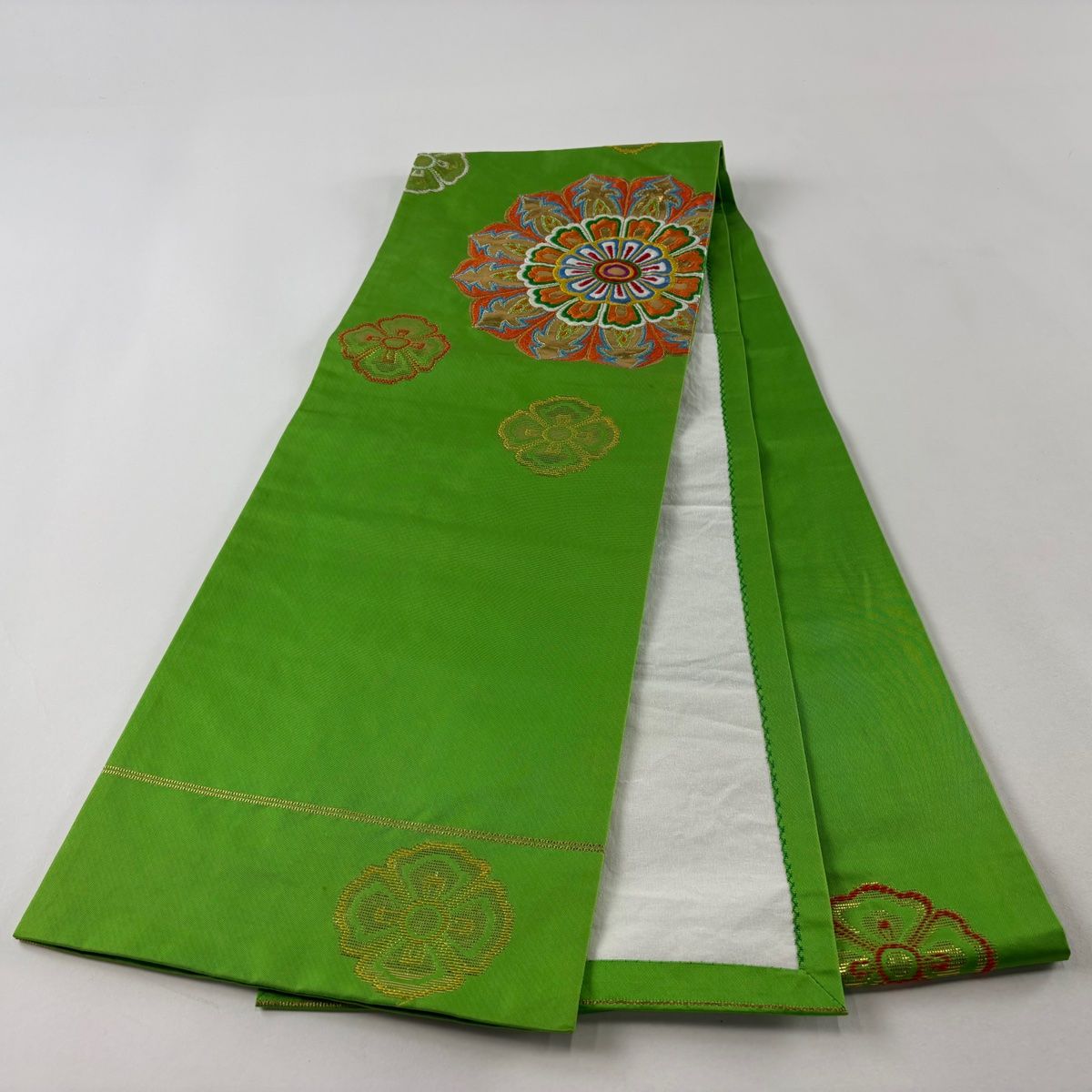 開き名古屋帯 名品 龍村美術織物 落款 たつむら 華文 箔 黄緑色 正絹