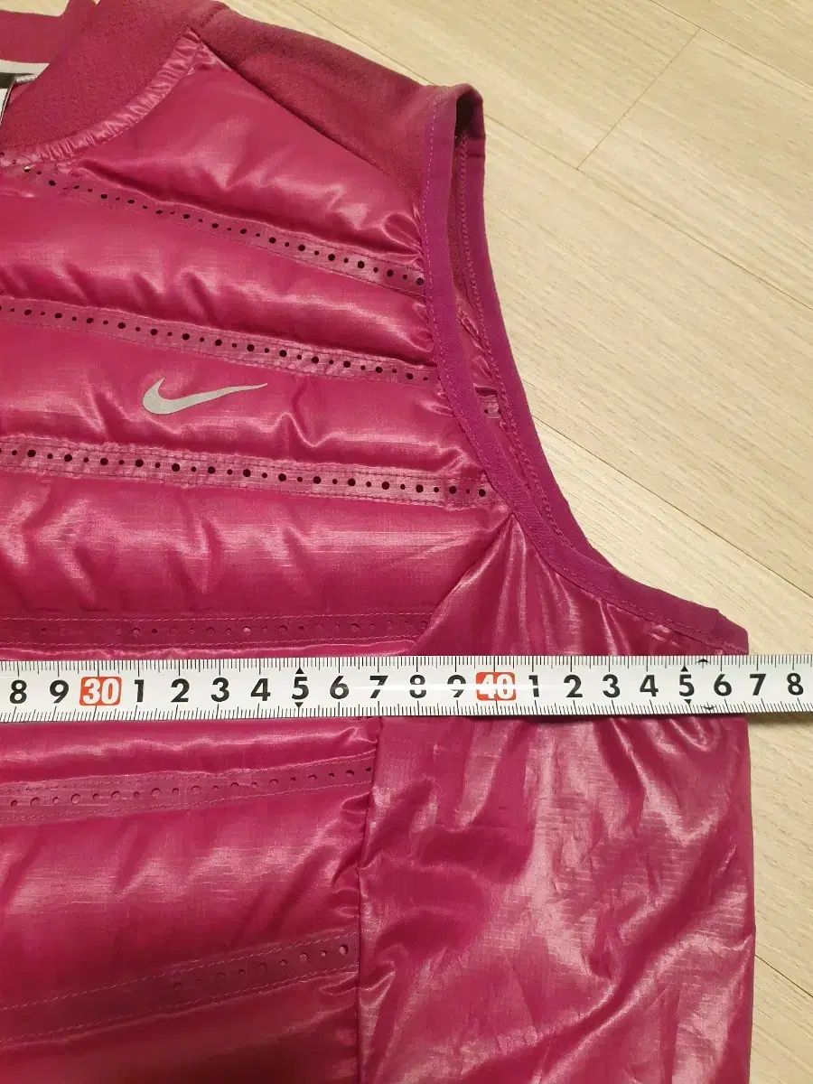 ナイキ エアロロフト ダウンベスト 90 - メルカリ