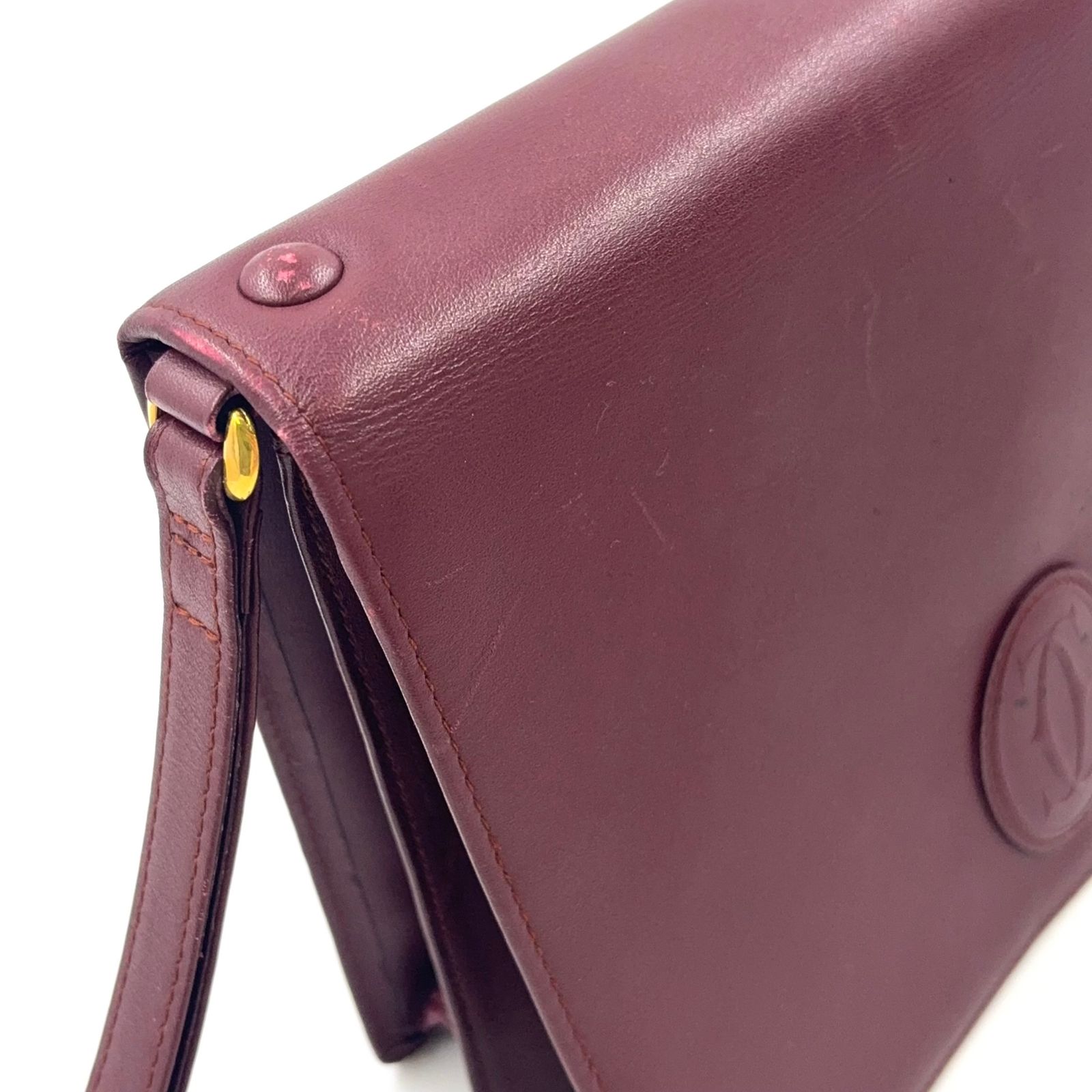 Cartier マストライン レザー ボルドー クラッチバッグ ゴールド