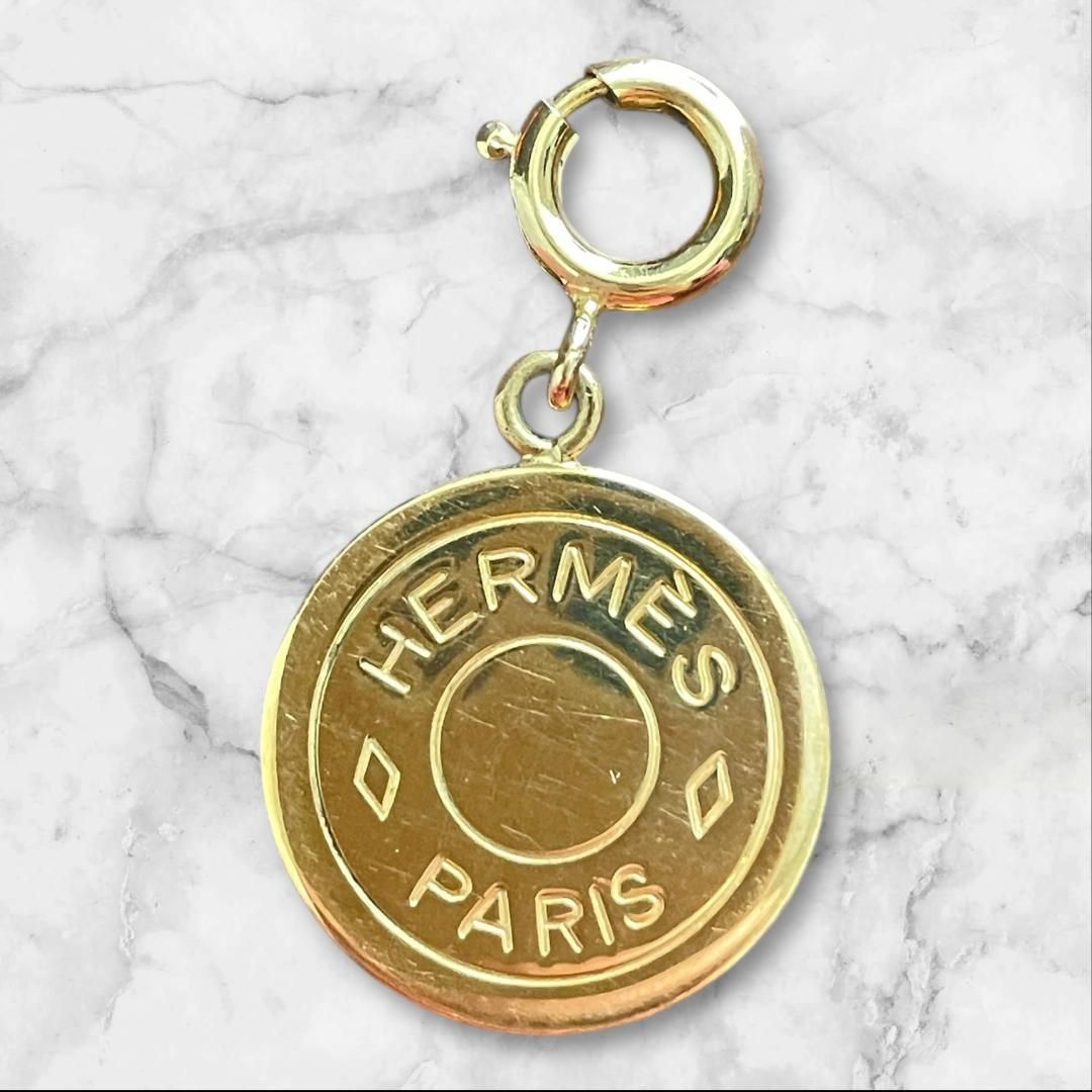 HERMES ゴールドロゴチャーム オレンジパッケージ付き - メルカリ