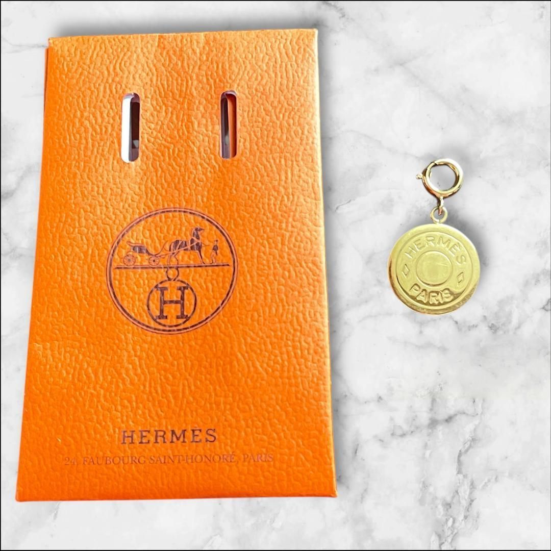 HERMES ゴールドロゴチャーム オレンジパッケージ付き - メルカリ