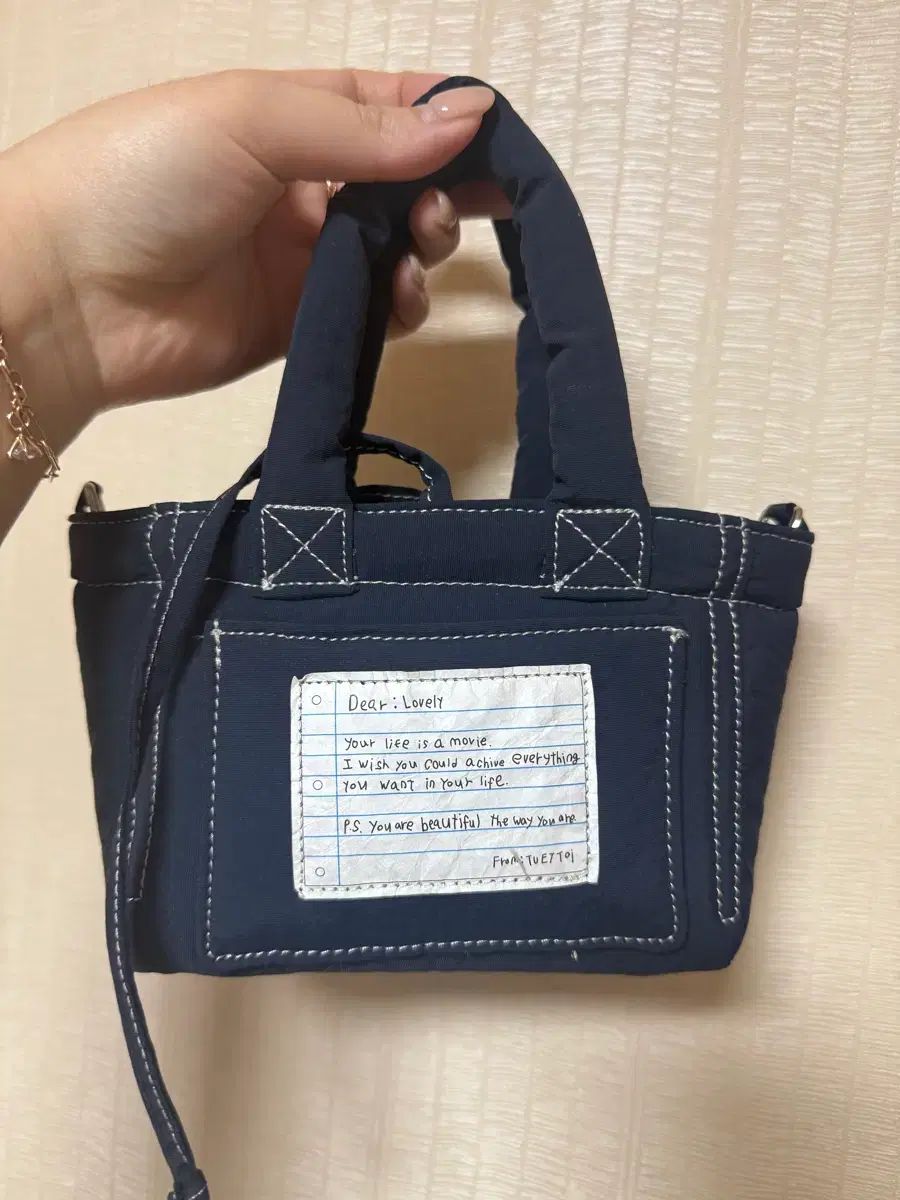 トゥエトゥア プチ ダウン クロスバッグ