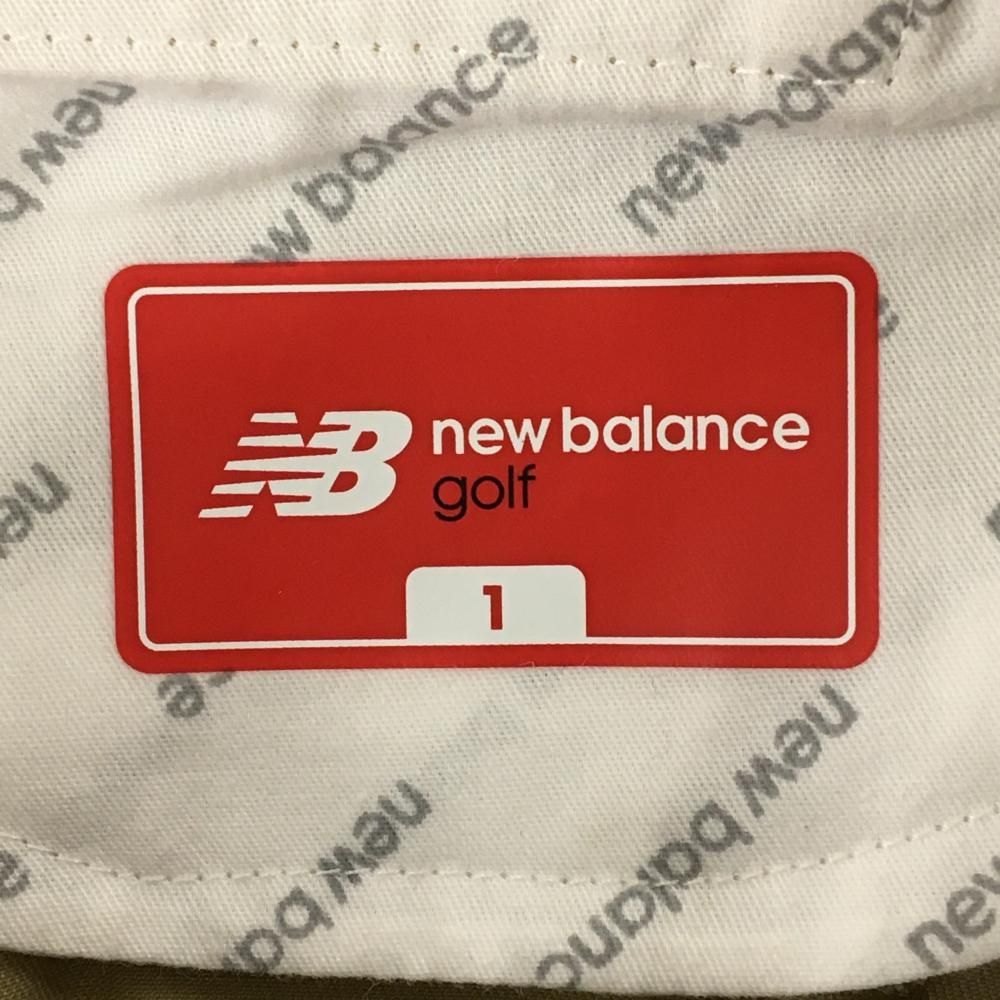 美品】ニューバランスゴルフ 七分丈パンツ ベージュ ロゴマルチカラー