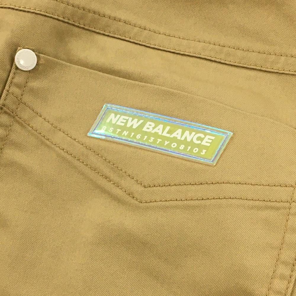 美品】ニューバランスゴルフ 七分丈パンツ ベージュ ロゴマルチカラー
