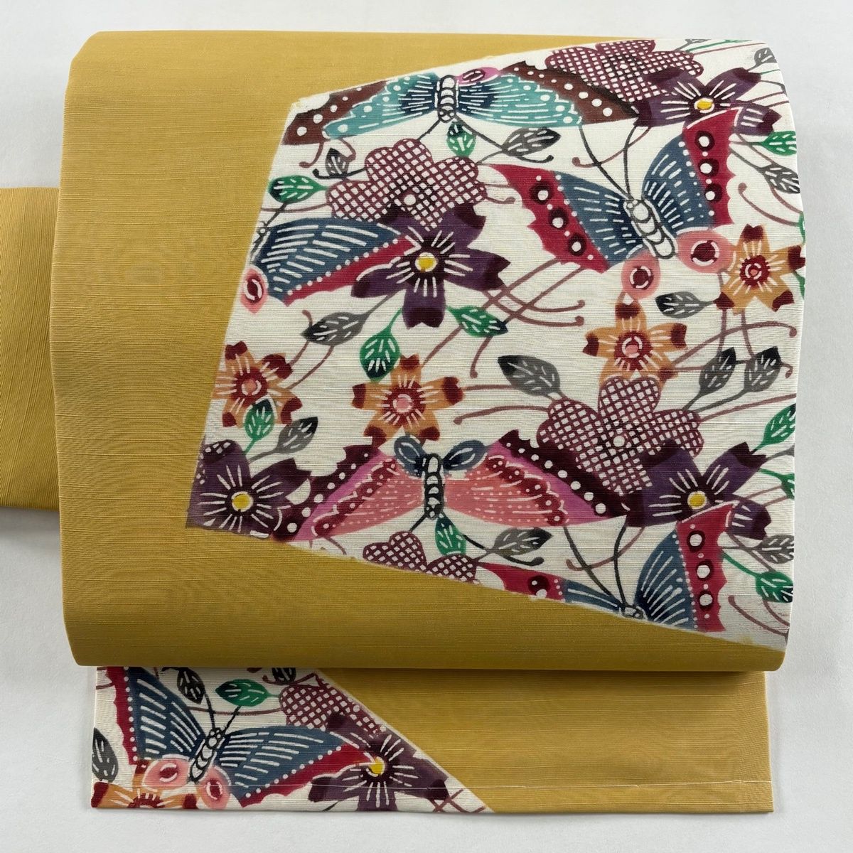 名古屋帯 秀品 紬地 草花 蝶 山吹色 正絹