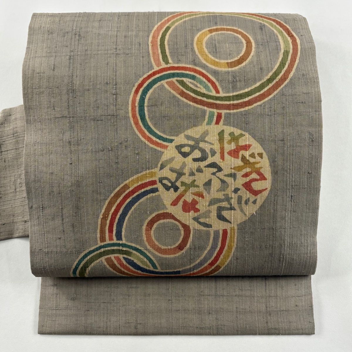 名古屋帯 秀品 紬地 丸紋 文字 灰茶 正絹