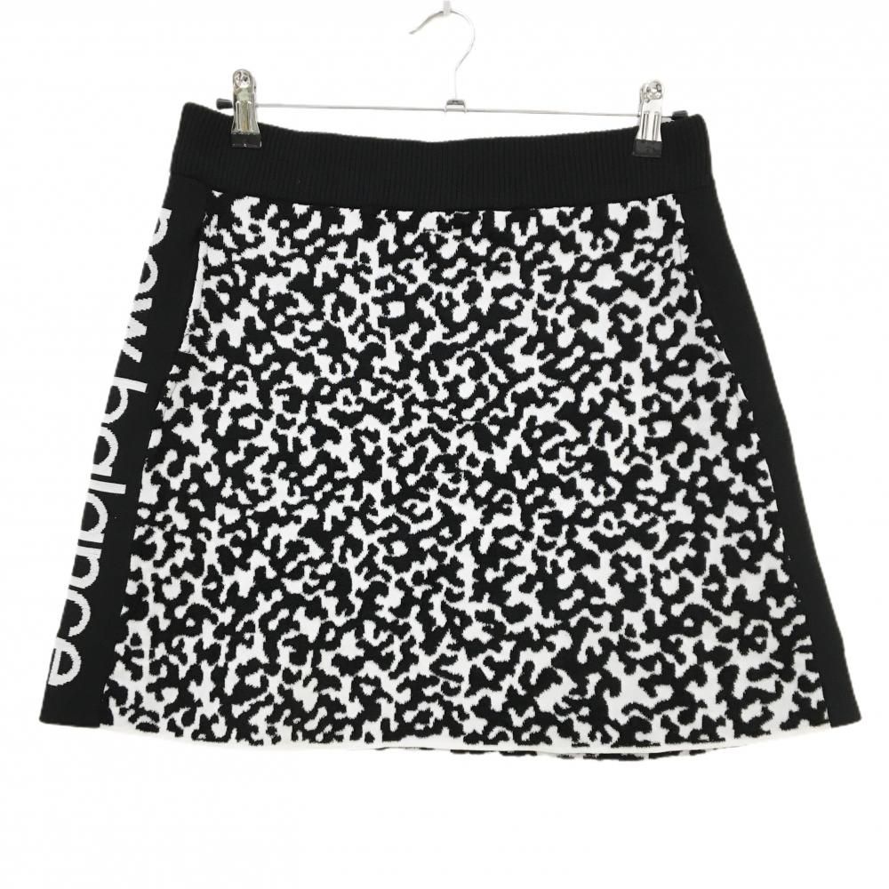 美品】ニューバランスゴルフ ニットスカート 黒×白 総柄 凹凸地 サイド