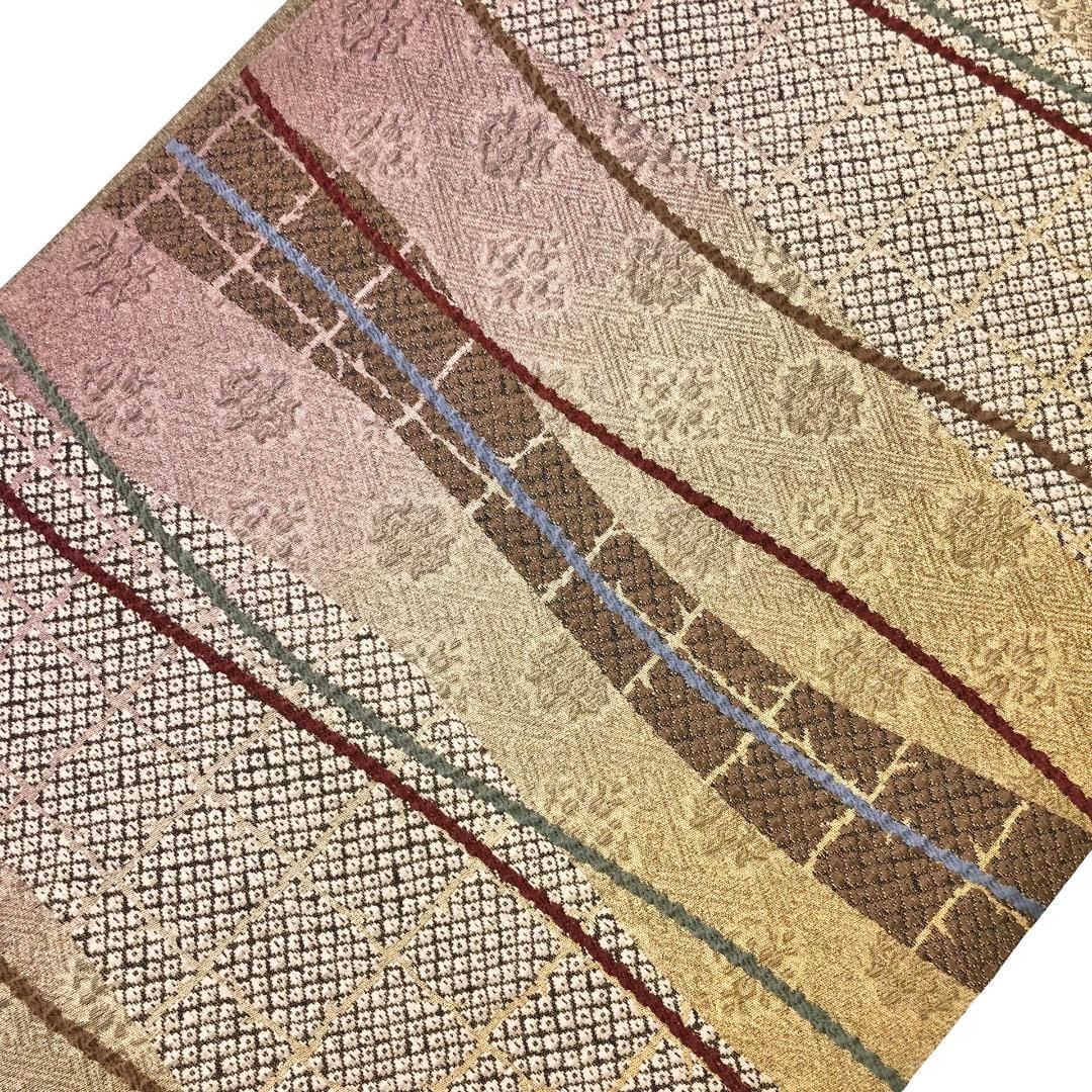 袋帯 曲線模様に格子 鹿子柄 華模様 楊梅色 金通し O-5789 - メルカリ