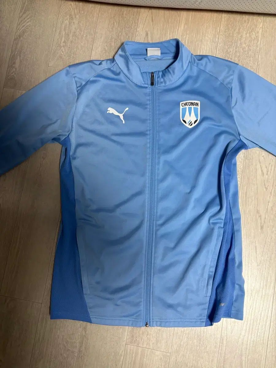25천안シティ FCトレーナー M ジャケット スカイブルー