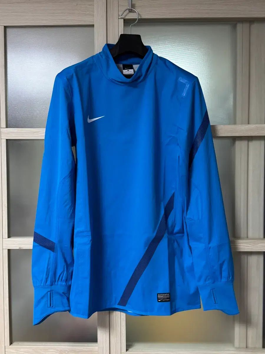 12|13 NIKE シェルトップ