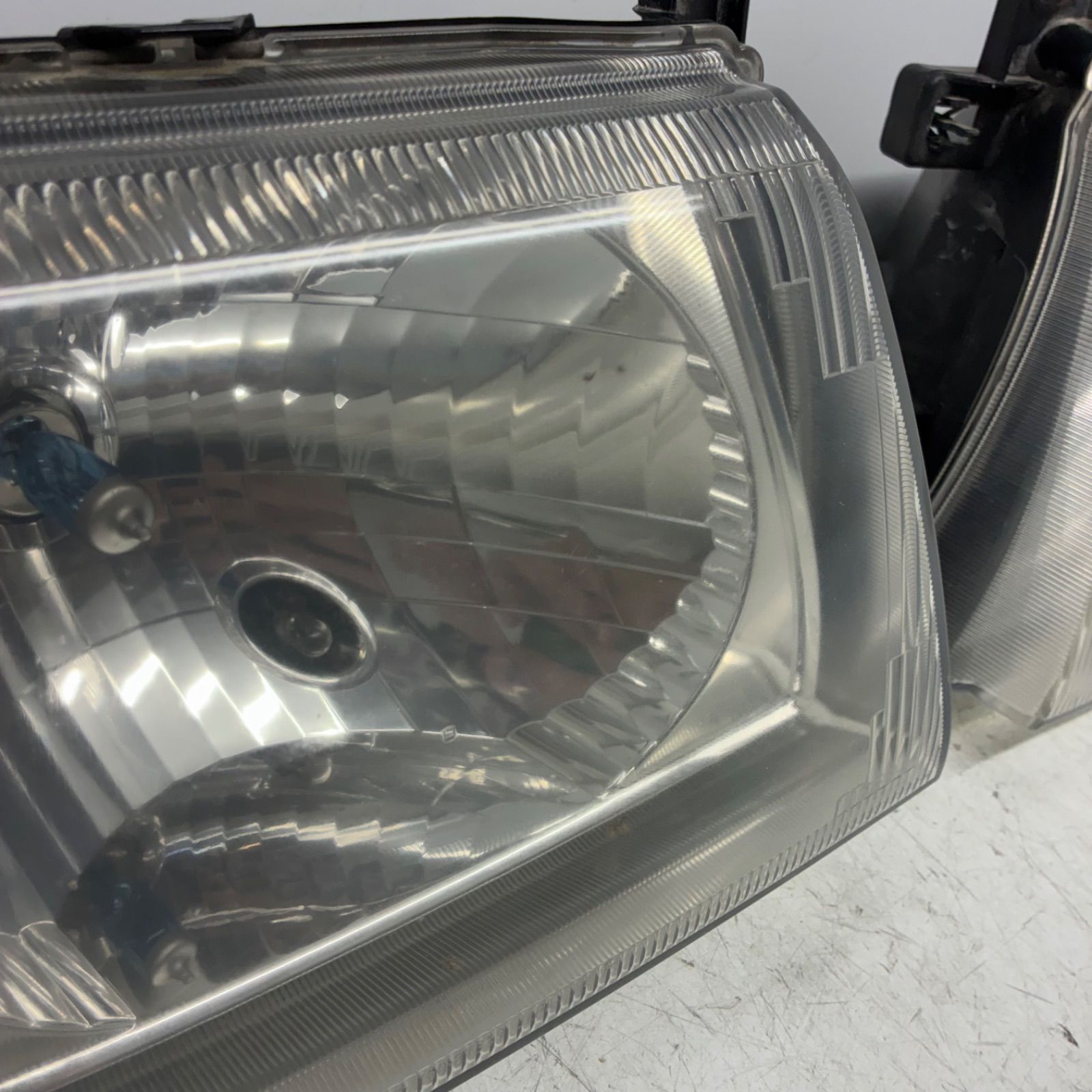 良品【コーティング済】三菱 H53A H58A パジェロミニ ヘッドライト