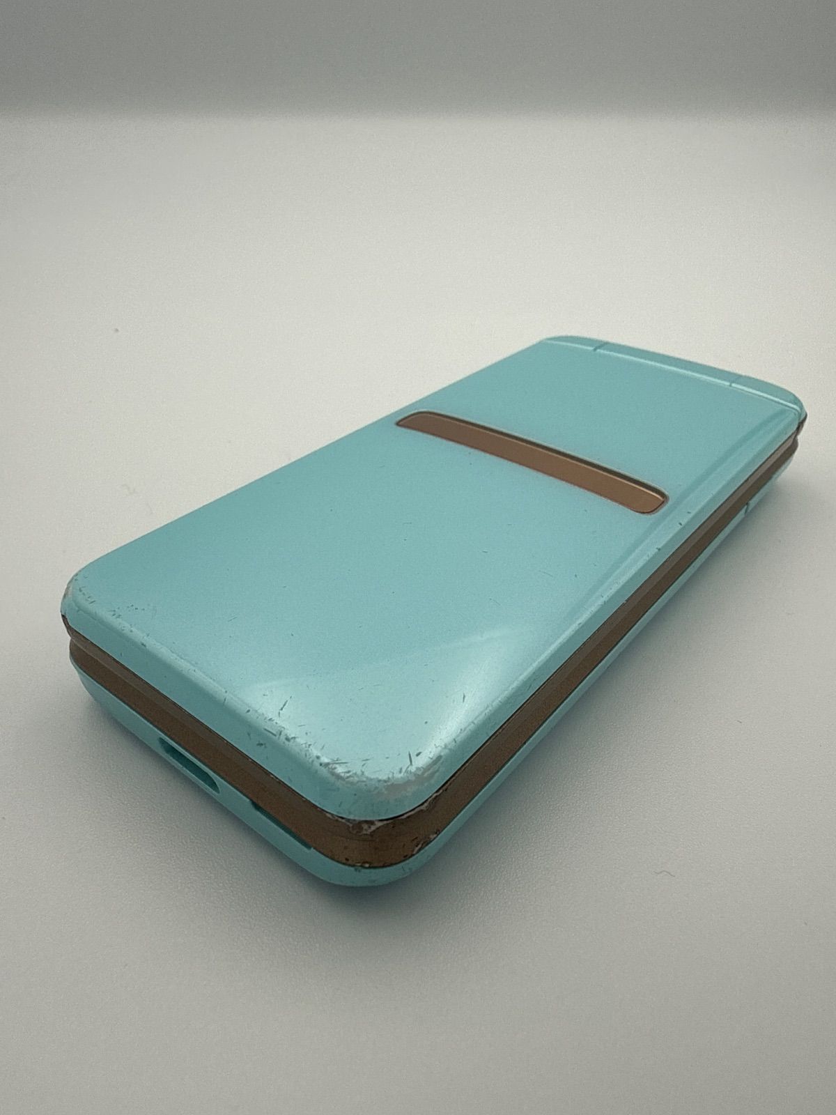 au ガラホ 京セラ GRATINA KYF39 薄水色 SIMロック解除済 折りたたみ型