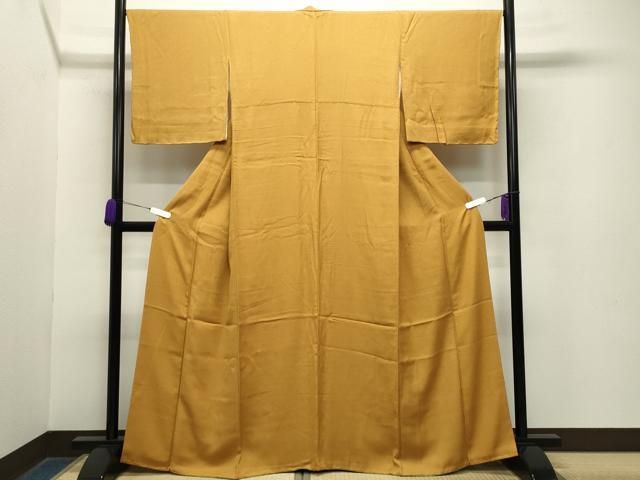 平和屋着物●上質な色無地 吉祥地紋 柑子色 正絹 gh