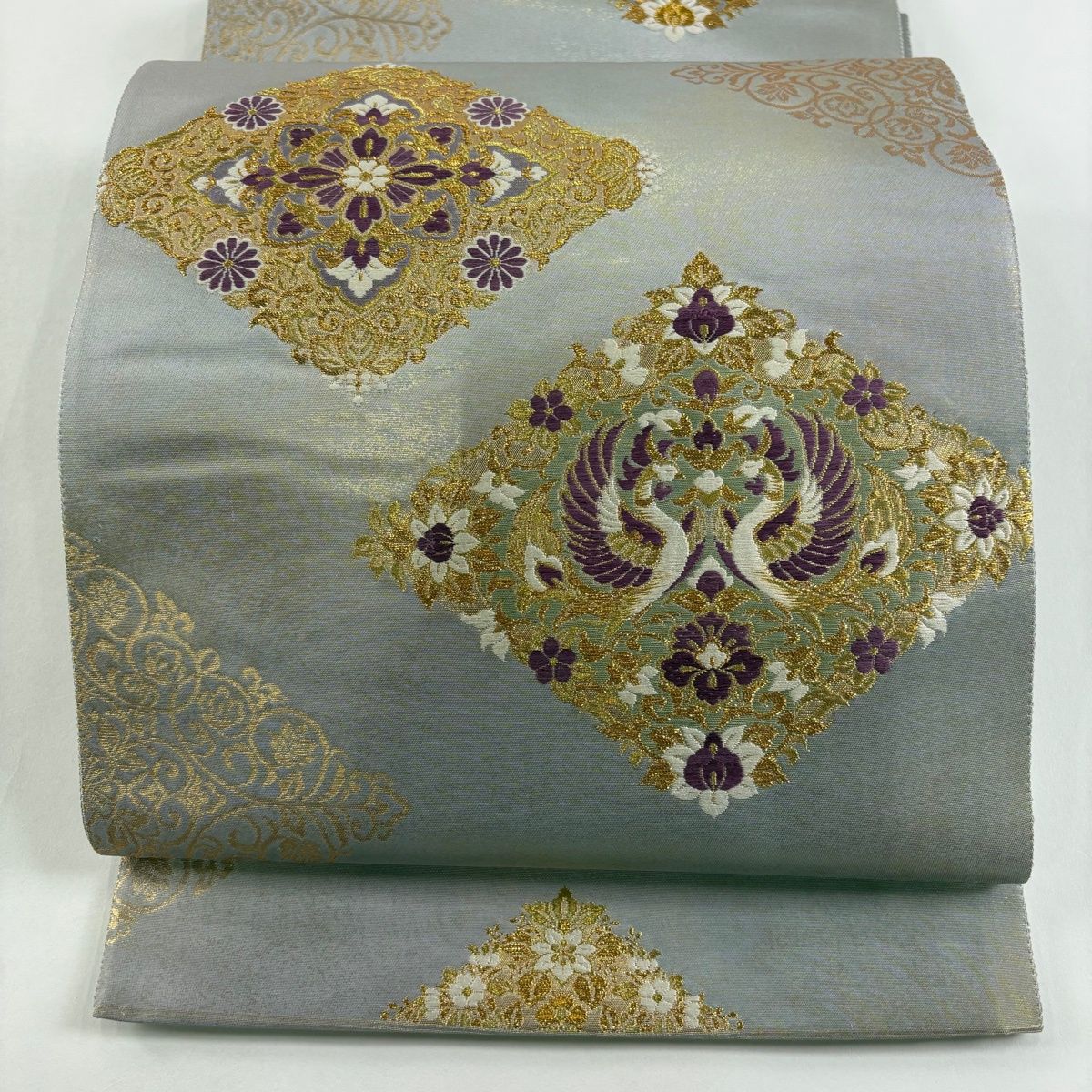 袋帯 名品 じゅらく 落款 じゅらく帝王紫 向鶴菱 華文 金糸 箔 灰色 お太鼓柄 正絹