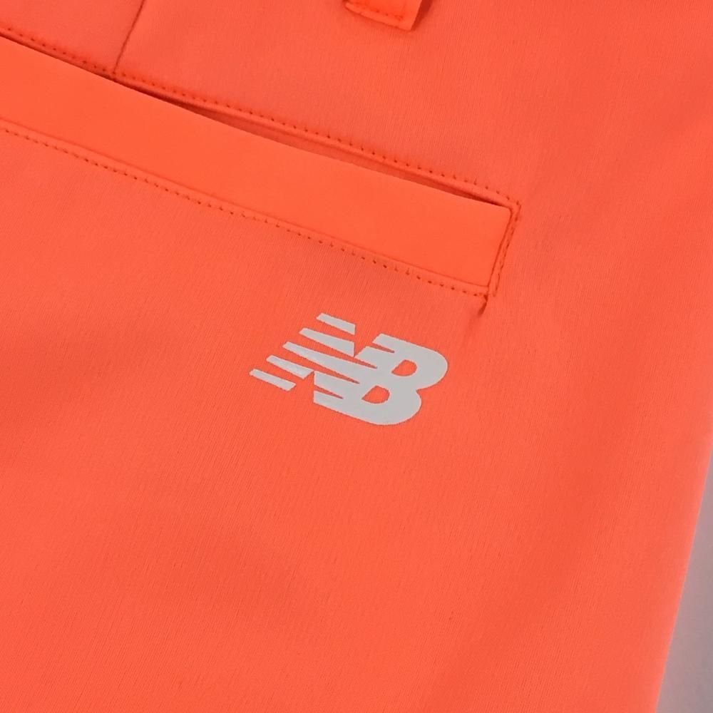 美品】ニューバランスゴルフ スカート 蛍光オレンジ×白 後裾プリーツ