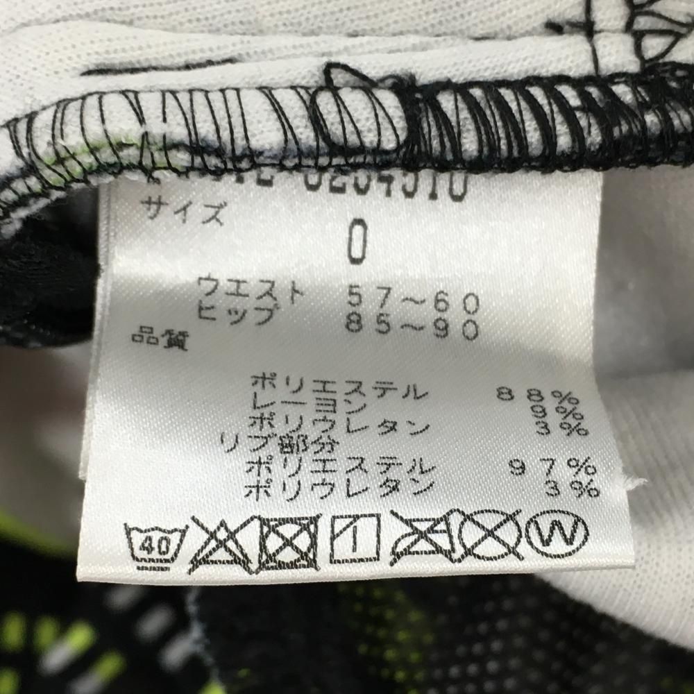 美品】ニューバランスゴルフ スカート 白×黒×蛍光イエロー 総柄 ロゴ