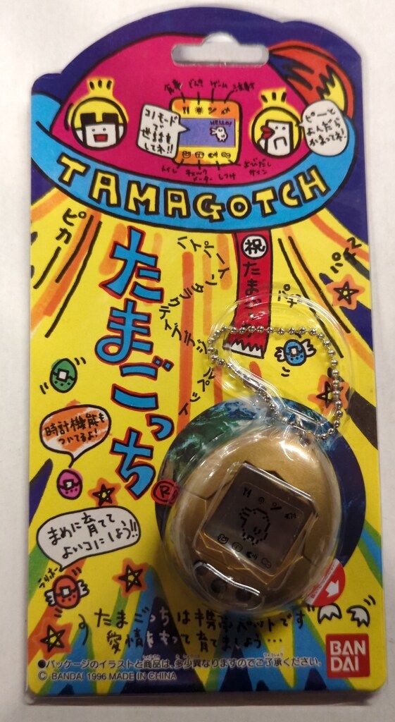 バンダイ たまごっち(初代) 金ボディ(黒ボタン/お正月モデル) - メルカリ