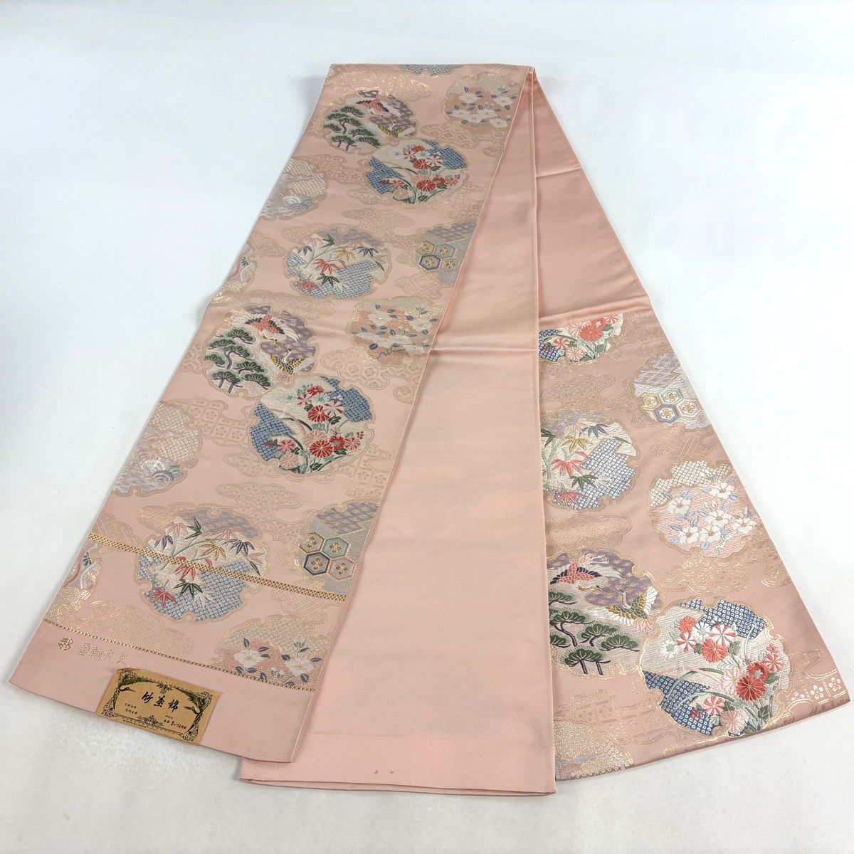 袋帯 秀品 まいづる 落款 雪輪丸文 金糸 箔 ピンク 六通 正絹 【中古