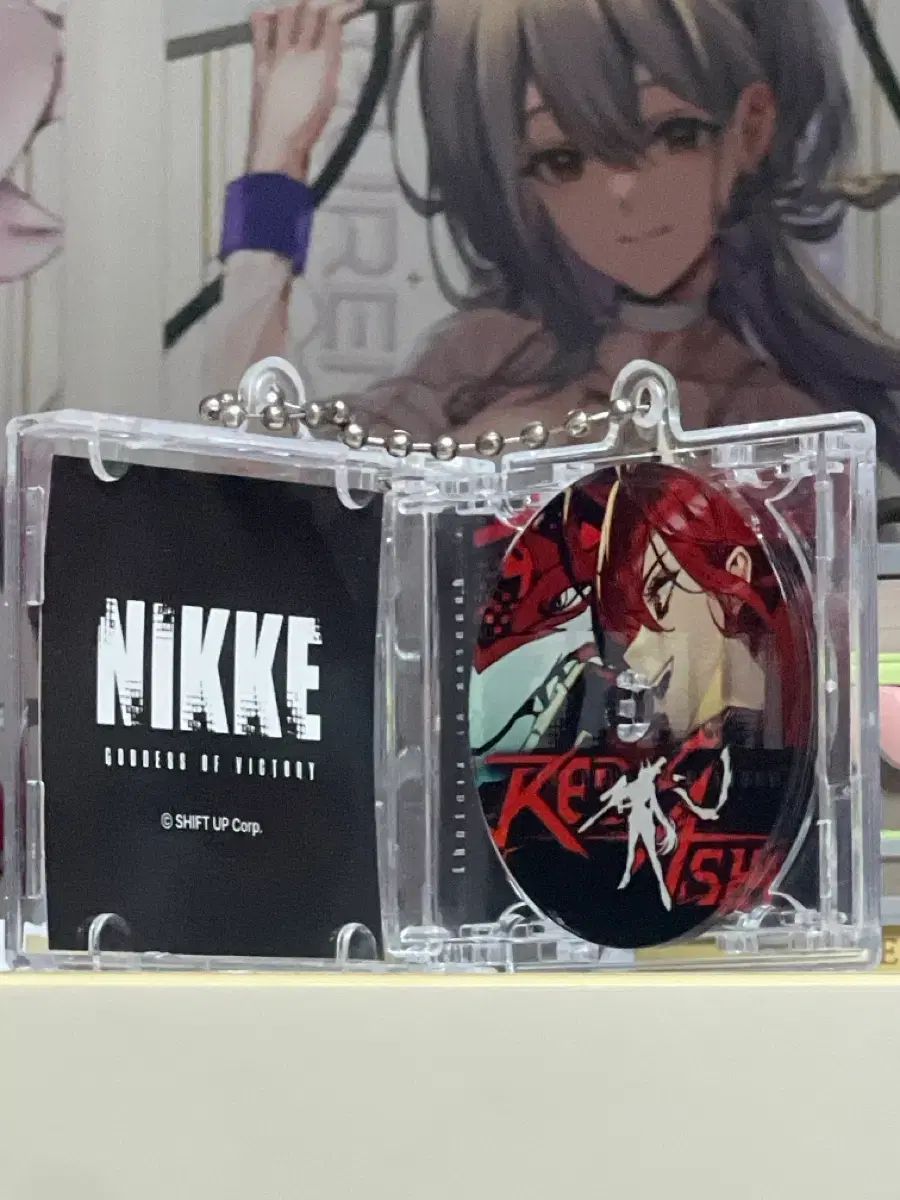 勝利の女神：NIKKE(ニケ) NFC CD キーホルダー レッドアッシュ - メルカリ