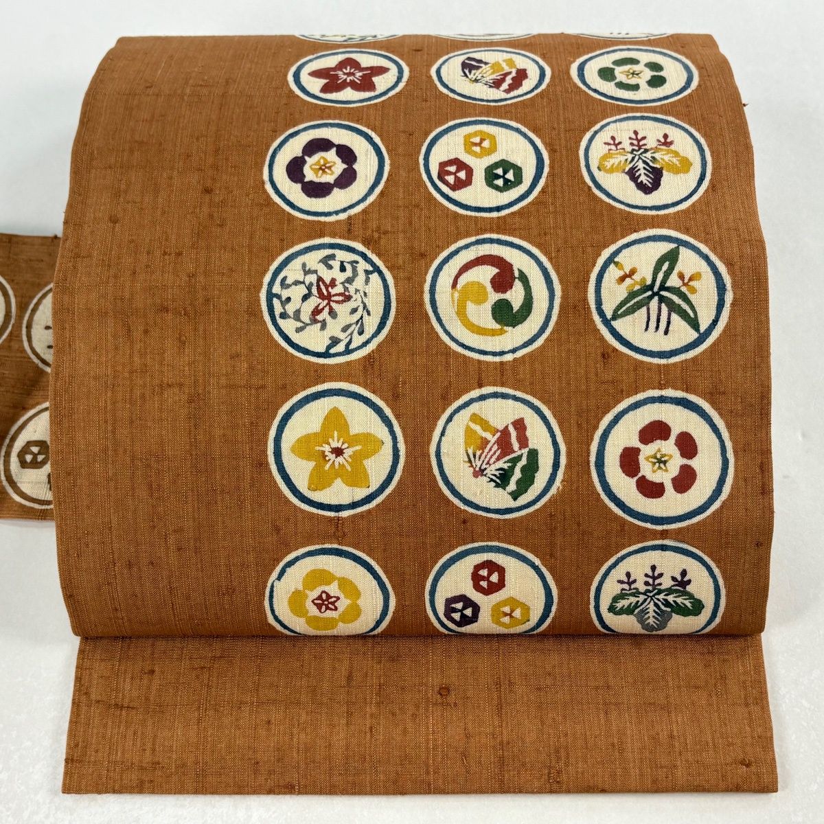 名古屋帯 秀品 落款 紬地 丸文 草花 茶色 正絹