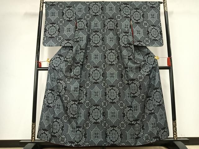 平和屋着物 本場大島紬 割り込み絣 雪輪花文 正絹 fy