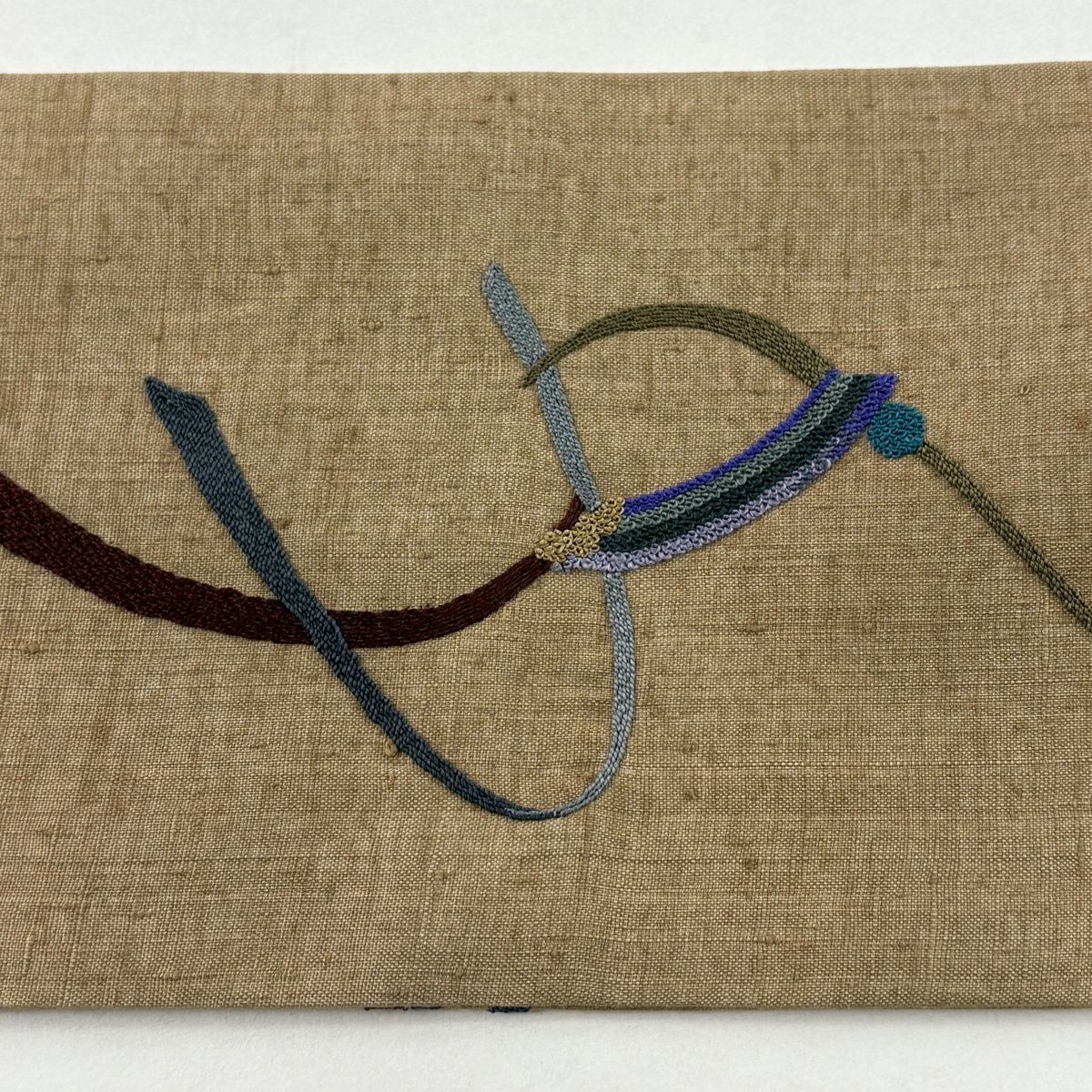 名古屋帯 秀品 紬地 流水 幾何学模様 刺繍 薄茶色 正絹 デニム 名古屋帯 