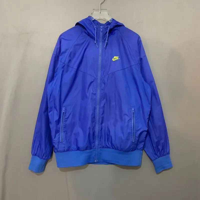 L NIKE ブルー ウィンドランナー ウィンドブレーカー WHO ジャケット