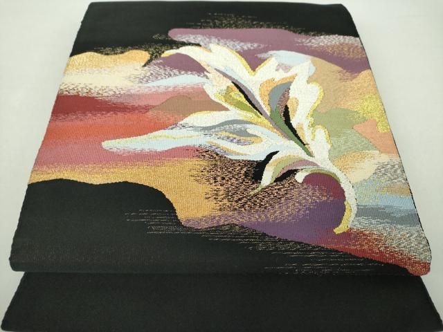 平和屋着物 綴錦織元 安田織鴻 爪掻き本綴れ 八寸名古屋帯 更紗花文 黒地 金銀糸 たとう紙 共 き 正絹 ps