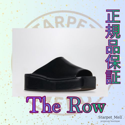 The Row ブラックエミフラットフォームサンダル